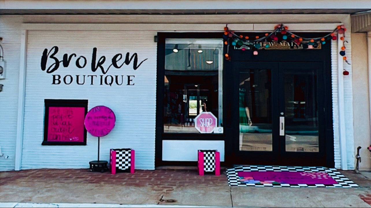 Front of Broken Boutique in Palestine, TX with decorative elements and sign.